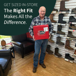 Man holding a red box with boots displayed on shelves in the background, featuring text about getting sized in-store | Boots & Soles | Effingham, IL